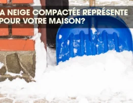 Man shoveling compacted snow from a home's entrance to prevent winter hazards.