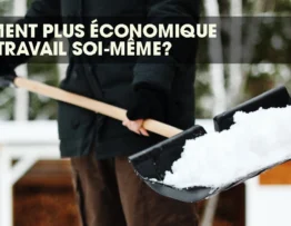 Person holding a snow shovel, ready to clear snow